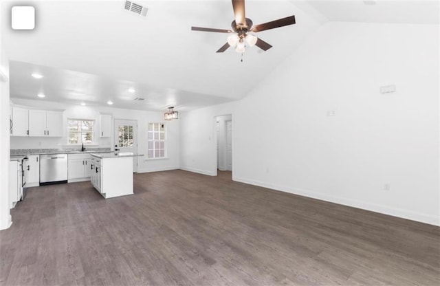 unfurnished living room with ceiling fan, high vaulted ceiling, and dark hardwood / wood-style floors