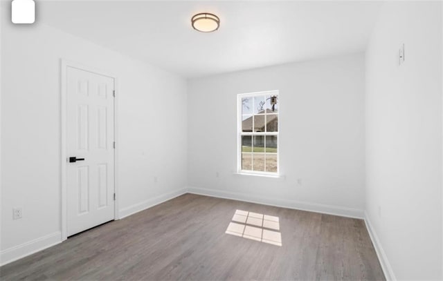 empty room featuring wood-type flooring