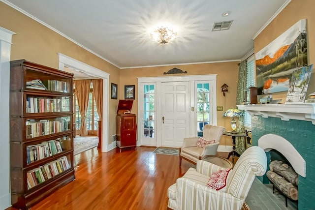 interior space with crown molding and hardwood / wood-style floors