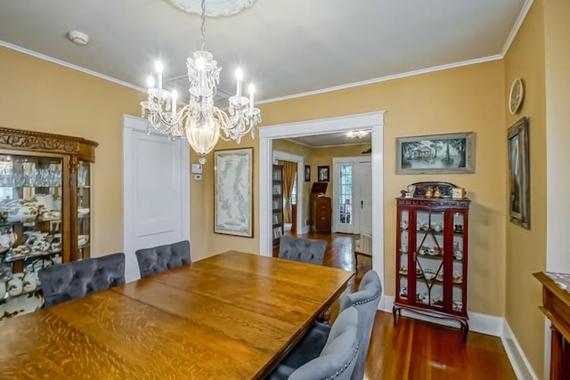 dining room featuring ornamental molding and dark hardwood / wood-style floors