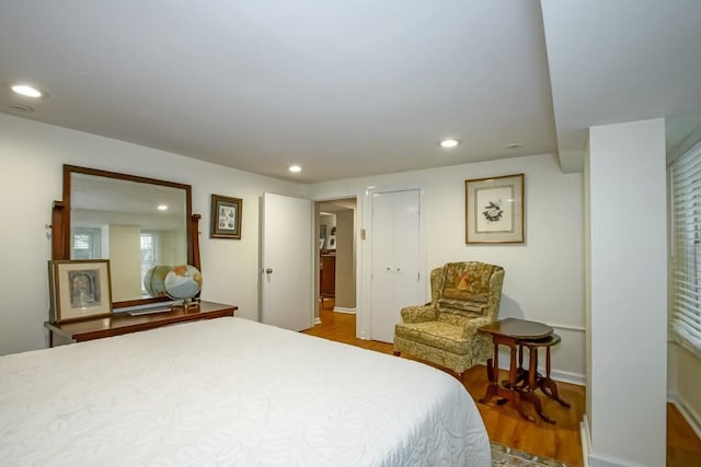 bedroom with hardwood / wood-style floors