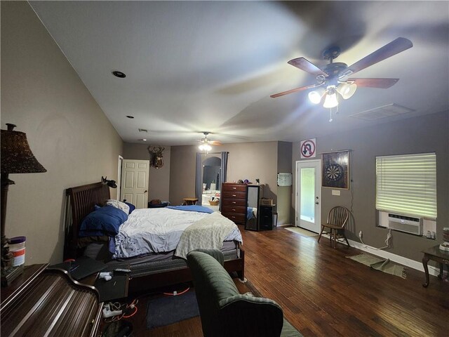 bedroom with cooling unit, ceiling fan, and dark wood-type flooring