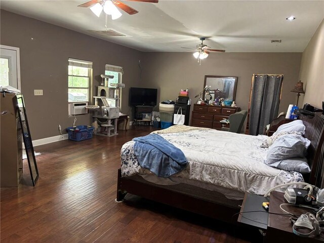84653 Camus Ln, Covington, LA 70435 - bedroom with visible vents, baseboards, and wood finished floors