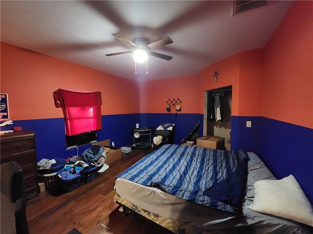 bedroom featuring a closet, ceiling fan, and hardwood / wood-style flooring