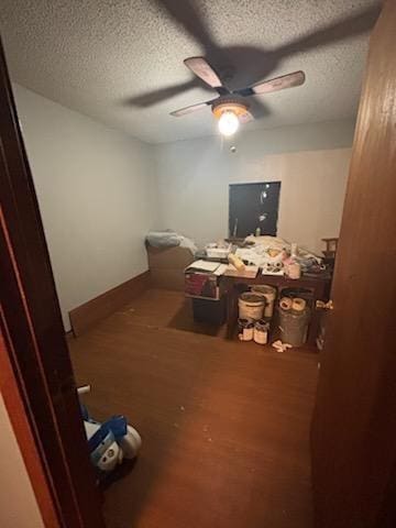84653 Camus Ln, Covington, LA 70435 - interior space featuring a textured ceiling, wood finished floors, and ceiling fan