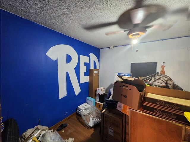 84653 Camus Ln, Covington, LA 70435 - bedroom featuring a textured ceiling, wood finished floors, and ceiling fan