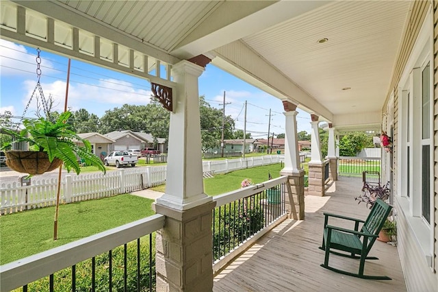 wooden deck with a yard