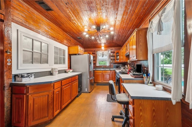 kitchen with wooden ceiling, stainless steel fridge with ice dispenser, an inviting chandelier, light hardwood / wood-style floors, and sink