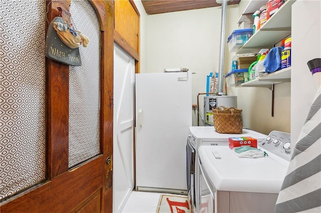 laundry area featuring light tile patterned floors and separate washer and dryer