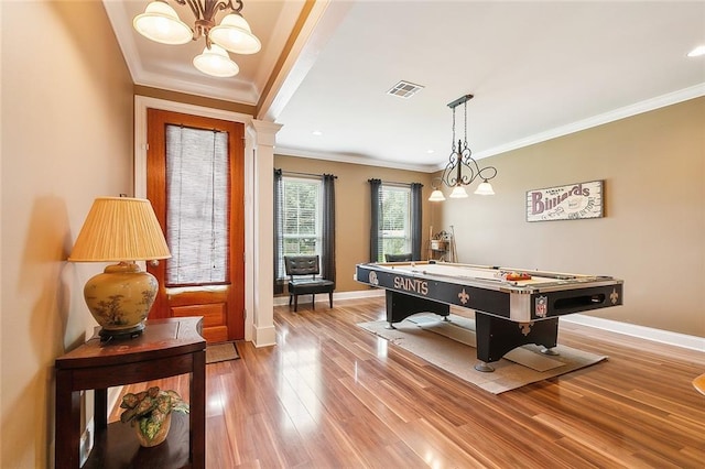 recreation room featuring billiards, an inviting chandelier, hardwood / wood-style flooring, and crown molding