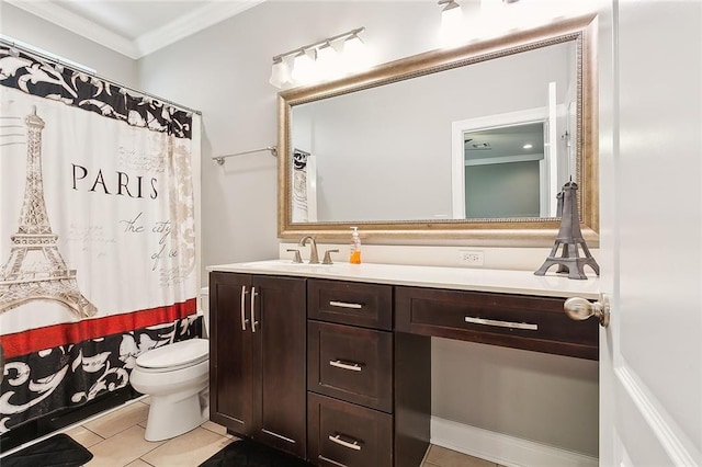 bathroom with toilet, tile patterned floors, vanity, and ornamental molding