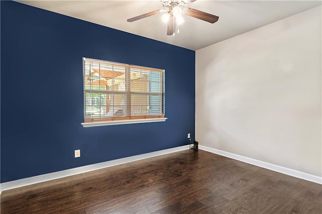 unfurnished room featuring dark hardwood / wood-style flooring and ceiling fan