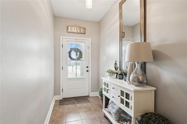 doorway featuring light tile patterned flooring