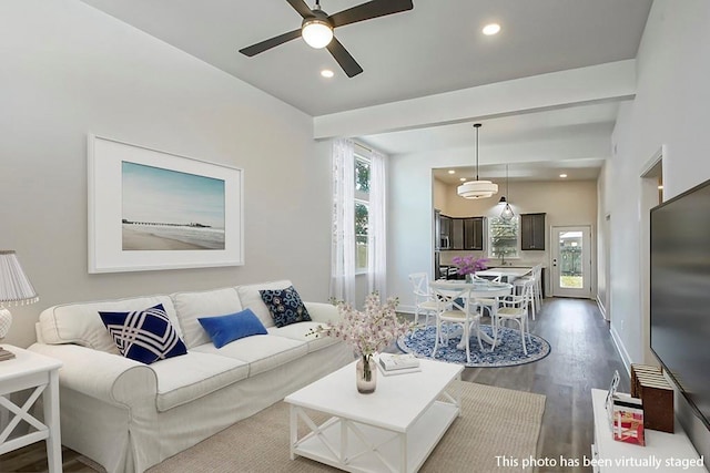 living room featuring a wealth of natural light, dark wood-type flooring, and ceiling fan