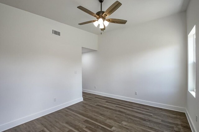 unfurnished room featuring dark hardwood / wood-style flooring and ceiling fan