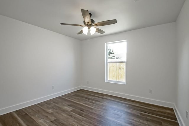 unfurnished room with ceiling fan and dark hardwood / wood-style floors