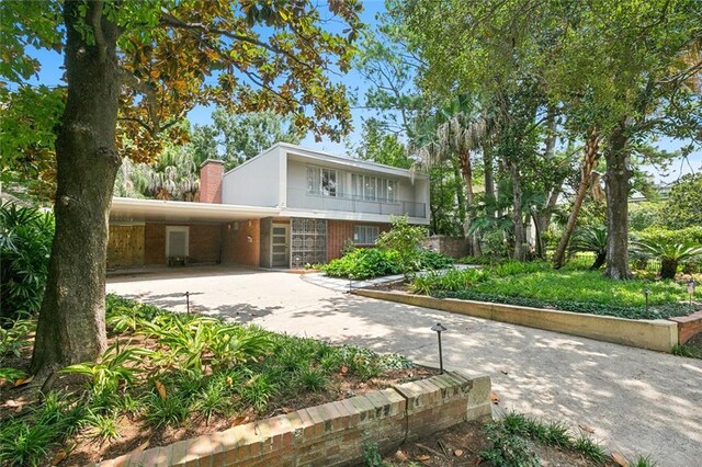 view of front of property with a carport