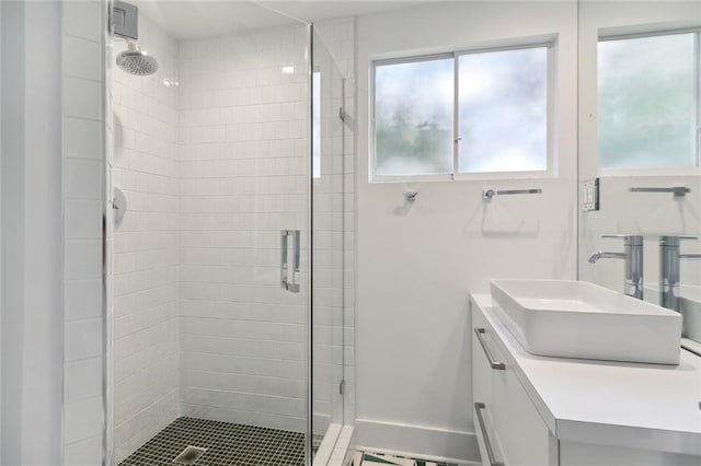 bathroom featuring vanity and walk in shower