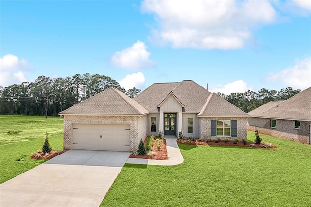 view of front facade with a garage and a front lawn