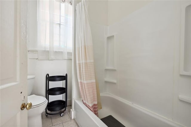 bathroom with toilet, shower / bath combo with shower curtain, and tile patterned floors