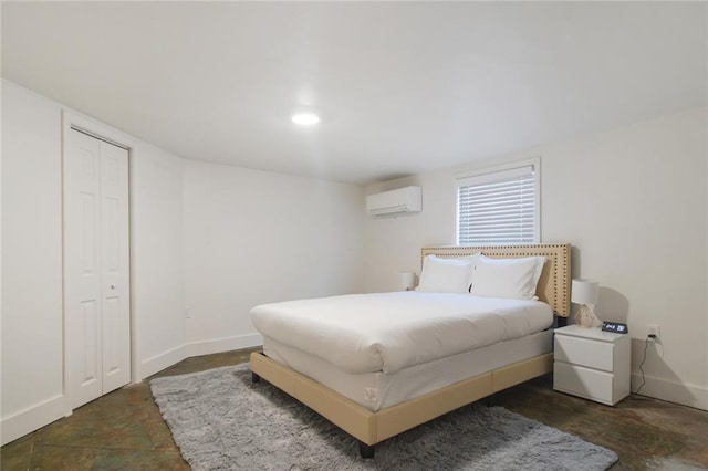 bedroom featuring an AC wall unit and baseboards