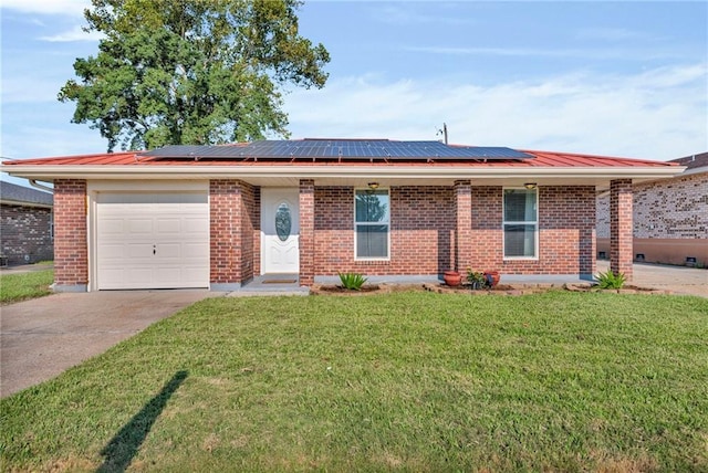 single story home with a garage, a front lawn, and solar panels