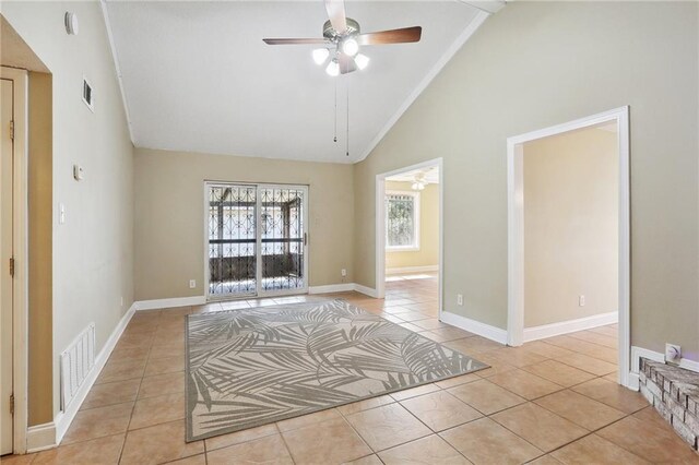 spare room featuring high vaulted ceiling, light tile patterned floors, and ceiling fan