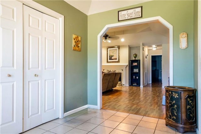 hallway featuring light tile patterned floors