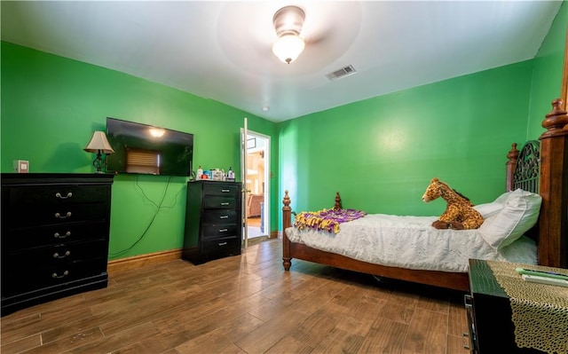 bedroom featuring ceiling fan and wood-type flooring