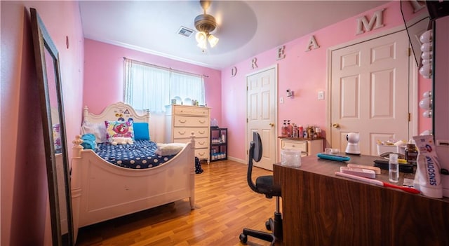 bedroom featuring ceiling fan and light hardwood / wood-style flooring