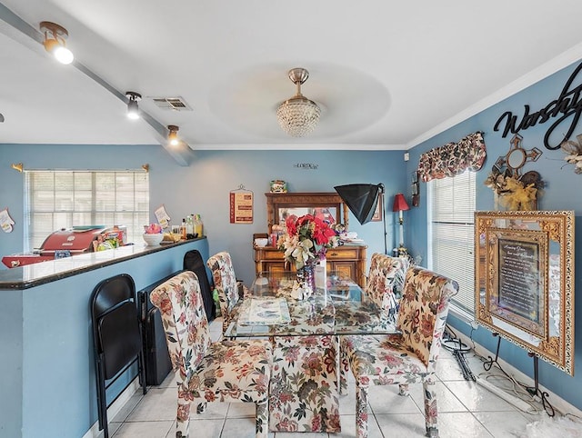 tiled dining space with crown molding