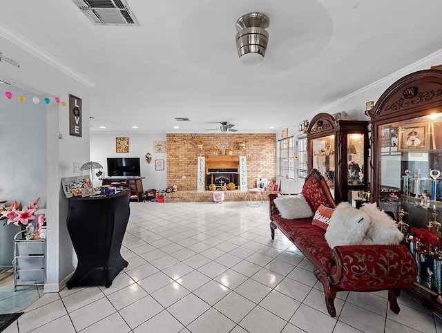 living room featuring ceiling fan, a fireplace, light tile patterned floors, and brick wall