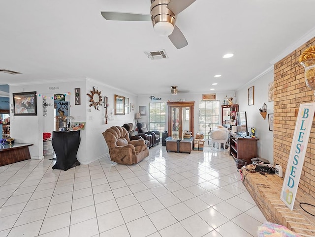 tiled living room with french doors, crown molding, and ceiling fan