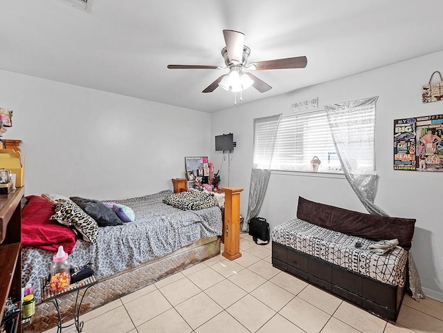 tiled bedroom with ceiling fan