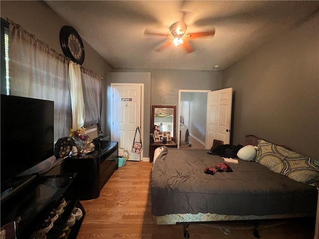 bedroom featuring ceiling fan and light hardwood / wood-style floors