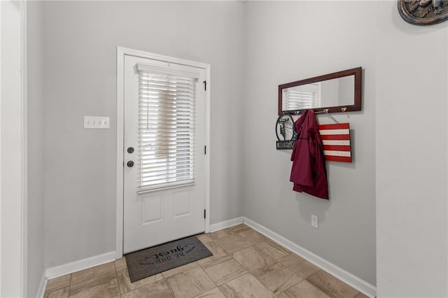 doorway with light tile patterned flooring