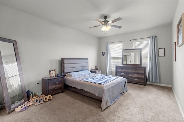 bedroom with ceiling fan and light colored carpet