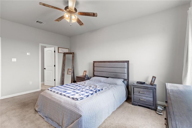 bedroom with ceiling fan and light colored carpet