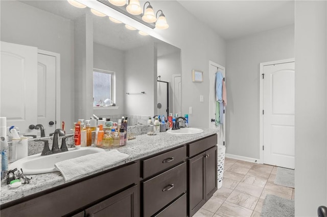 bathroom with tile patterned floors and dual vanity