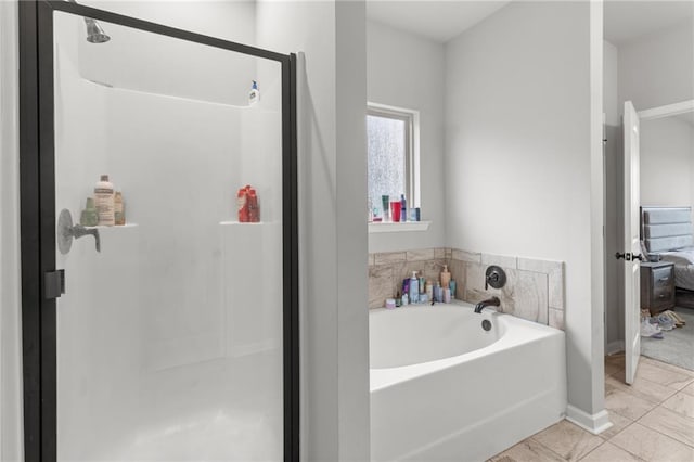 bathroom with plus walk in shower and tile patterned flooring