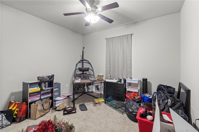 interior space with ceiling fan