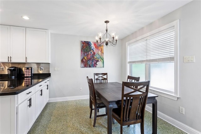 dining space featuring an inviting chandelier