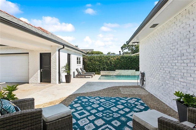 view of patio / terrace with a fenced in pool