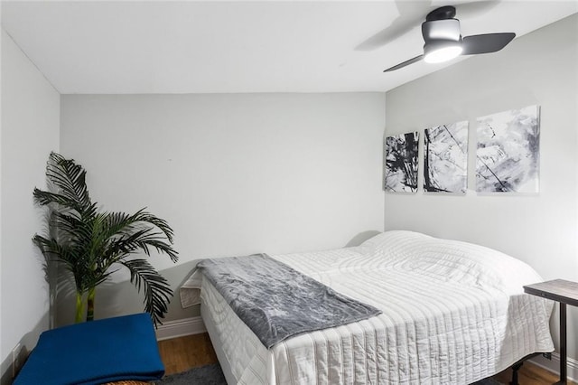 bedroom with hardwood / wood-style floors and ceiling fan