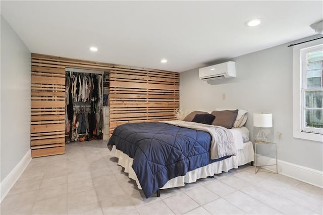 3722 Nashville Ave, New Orleans, LA 70125 - bedroom with recessed lighting, an AC wall unit, baseboards, and light tile patterned flooring
