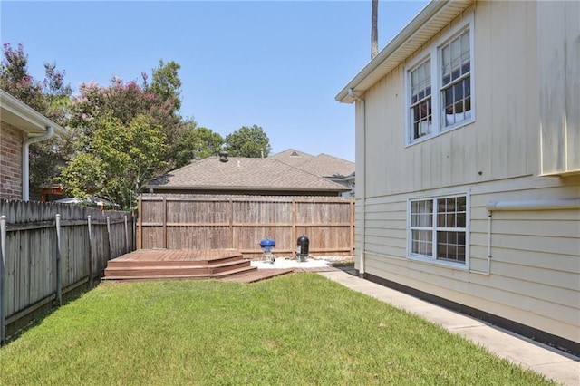 view of yard featuring a wooden deck