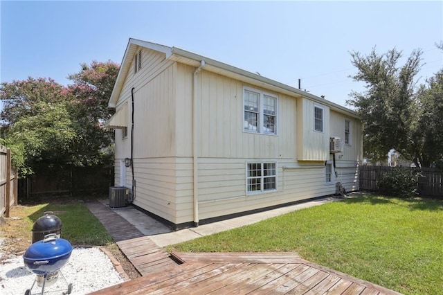 3722 Nashville Ave, New Orleans, LA 70125 - back of property featuring a wooden deck, a fenced backyard, a yard, and cooling unit