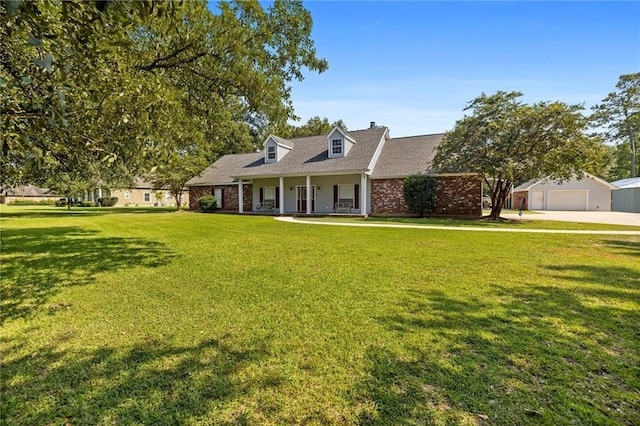 cape cod house with a garage, a front yard, and a porch