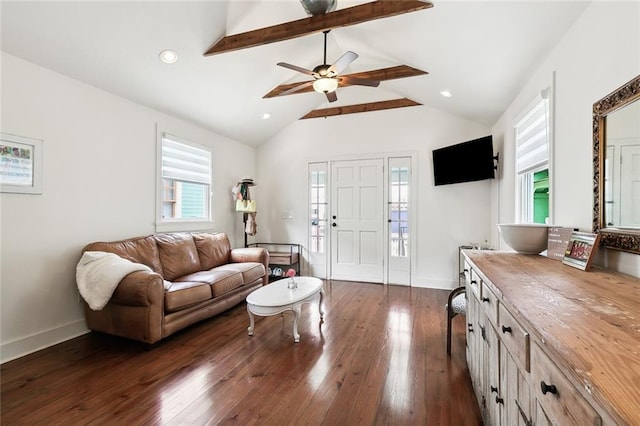 living room featuring ceiling fan, dark wood-type flooring, lofted ceiling with beams, and plenty of natural light