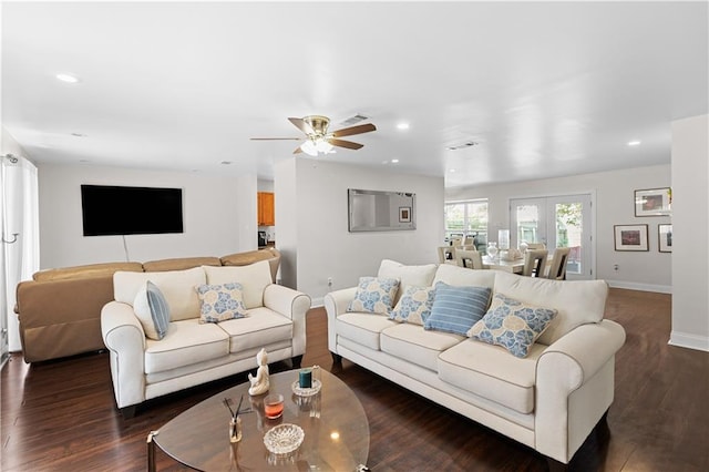 living room featuring ceiling fan, french doors, and dark hardwood / wood-style flooring